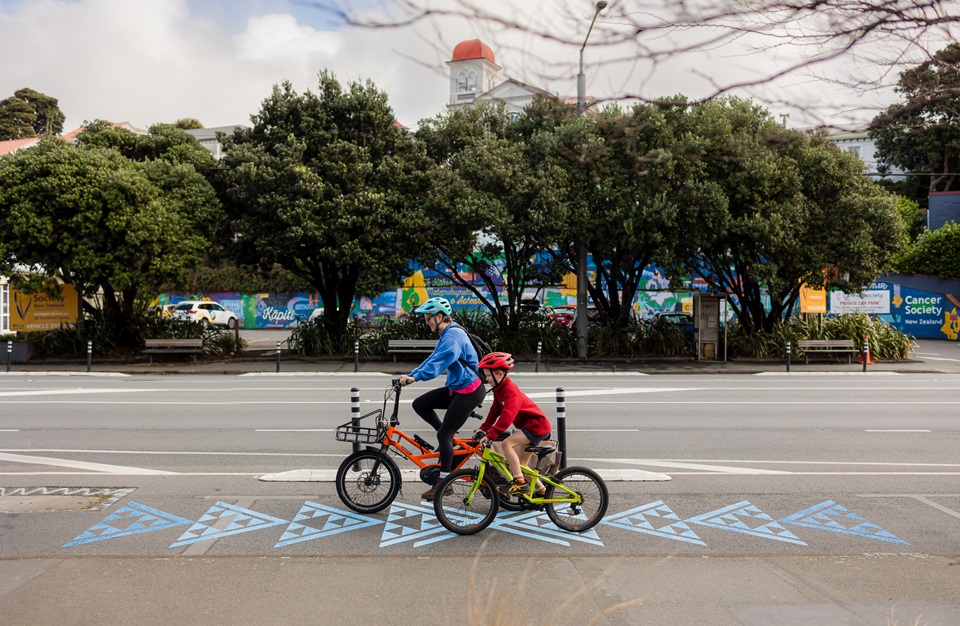 Cyclists crossing the awa markings on bike lane in Newtown.