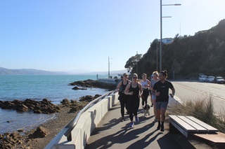 People running around Point Jerningham.