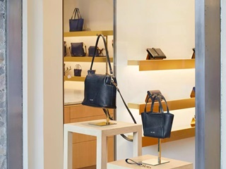 Leather hand bags in a shop.