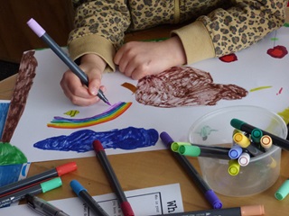 Child drawing on a piece of paper.
