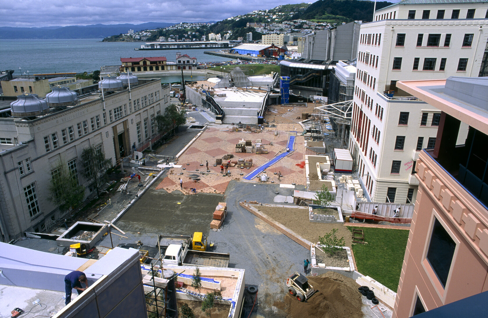 Birds eye view over Te Ngākau  Civic Square with City Gallery on the left and the Town Hall on the right.