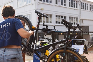 Person from Bikespace fixing up a bike.