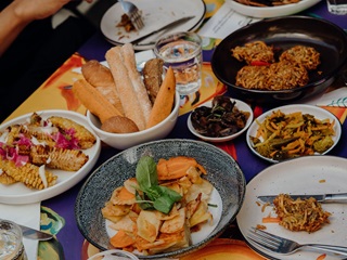 Harvest festival meal with plates full of food on the table.