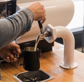 Someone using a milk tap.
