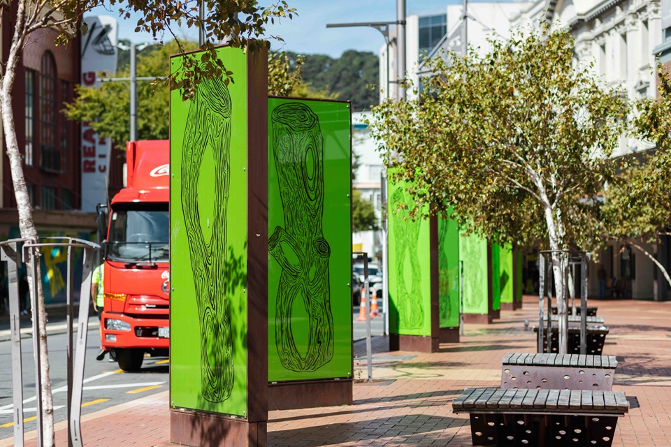 Turumeke Harrington Swamped artwork along Courtenay Place with St James in background.