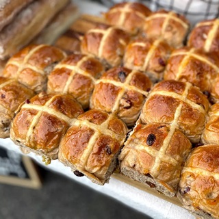 Hot cross buns in a row from Shelly Bay Baker.