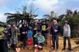 Group of cyclists on top of Makara Peak smiling for the camera.