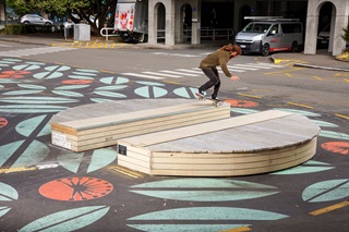 Skateboarder tests temporary installation equipment at MFC car park space.