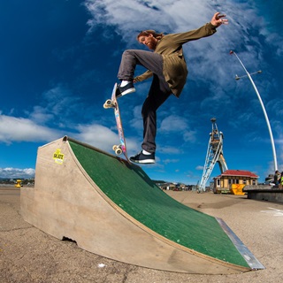 Person skateboarding on a ramp.