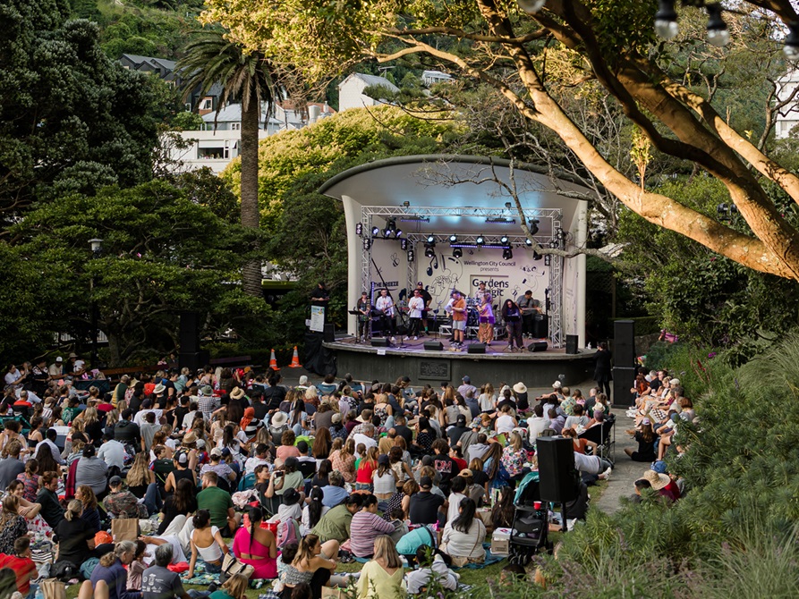 Gardens magic crowd and stage.