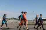 People walking across the road.