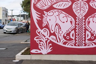 Painted horses on a red background.
