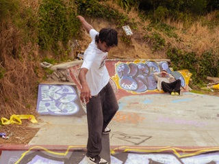 Two men skating.