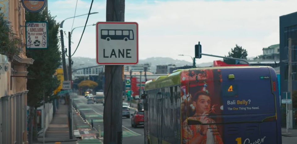 Bus in bus lane on Adelaide Road with Bus Lane sign in the foreground.