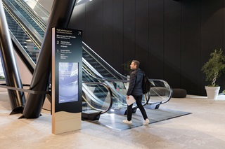 Image of Darren and his signage at Tākina