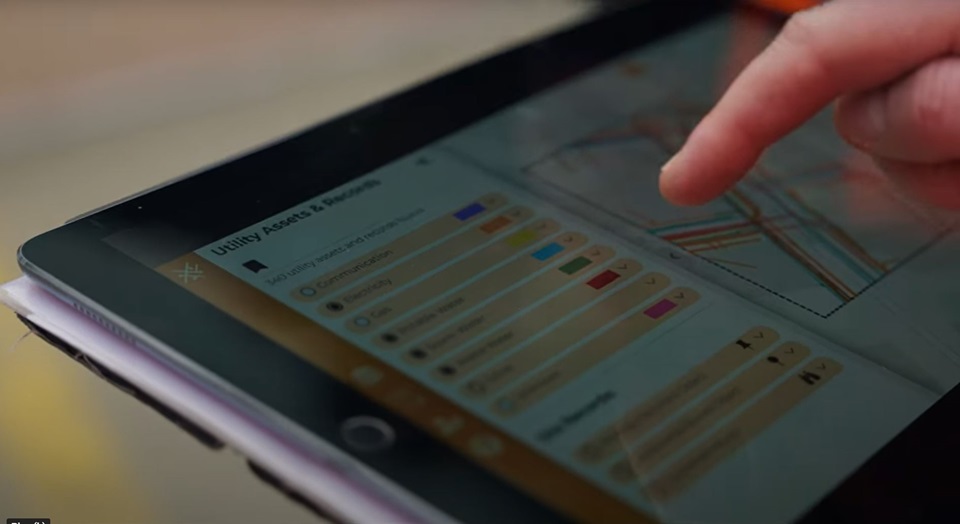 Inputting data on the Underground Asset Register for Wellington on a computer pad.