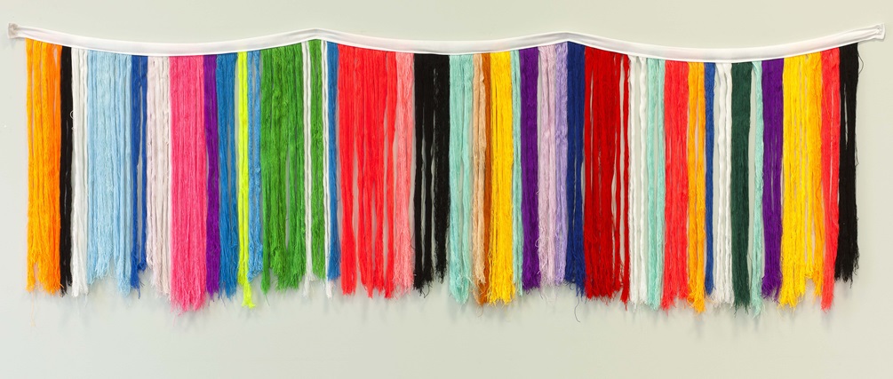 Image of colourful fringe on a wall