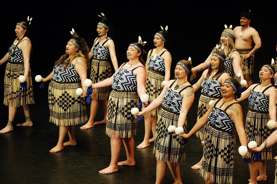 Te Ahi a Tahurangi kapa haka group in action on stage.