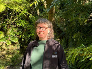 Portrait of WCC Gardener Fleur amongst the greenery of the Botanic Gardens