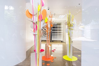 Art installation inside an empty retail space.