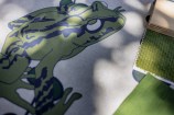 Sketch of a frog with green fabric samples.