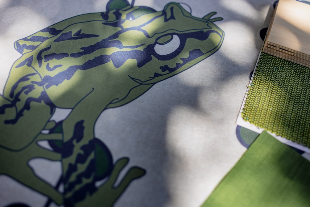 Sketch of a frog with green fabric samples.