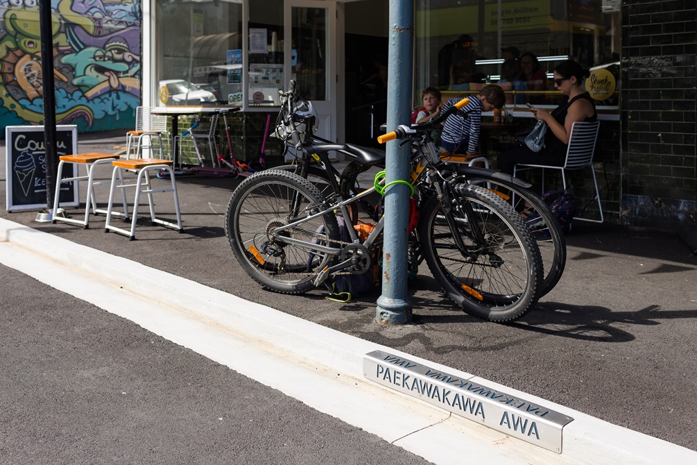 Bikes parked on the footpath.