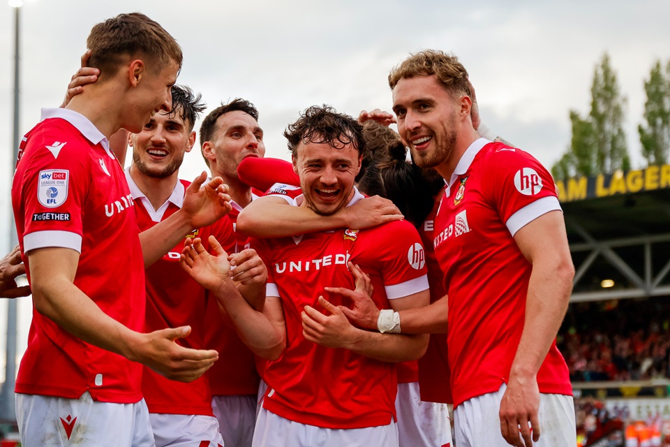 Wrexham AFC celebrating at stadium during match.
