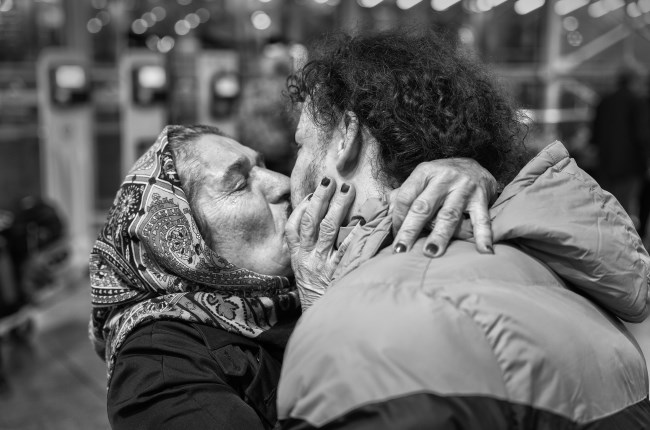 Photo credit EBRAHIM ALIPOOR - Mohammad, 22, shares a final, poignant farewell with his mother before embarking on his journey to Europe. 