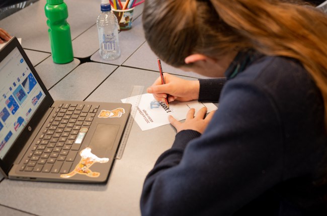 A girl drawing on a paper