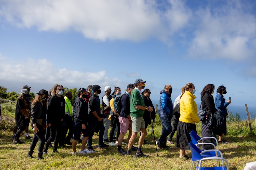 People gathered at the top of Tawatawa Reserve to celebrate the completion of the restoration of the pou