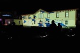 The Star Boating club lit up with an animated projection of stingrays swimming across the building.