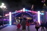 Ahi Kā attendees pass through an entry gate constructed of LED panels evoking Māori designs and motifs.