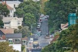 Distant photo showing asphalt being laid on a Wellington street.