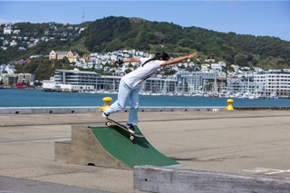 A teenager skating on a ramp on the Wellington waterfront.