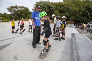 Children learning to skateboard at the new Tawa skatepark.