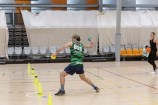 People playing dodgeball indoors.