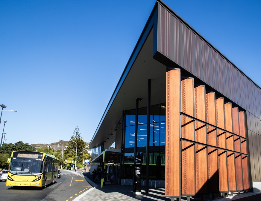 The outside of Waitohi Johnsonville community hub, and a bus sitting outside on the road.