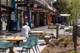 Island Bay shopping centre showing seating alongside the footpath.