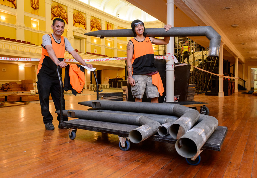 Moving the organ pipes to storage.